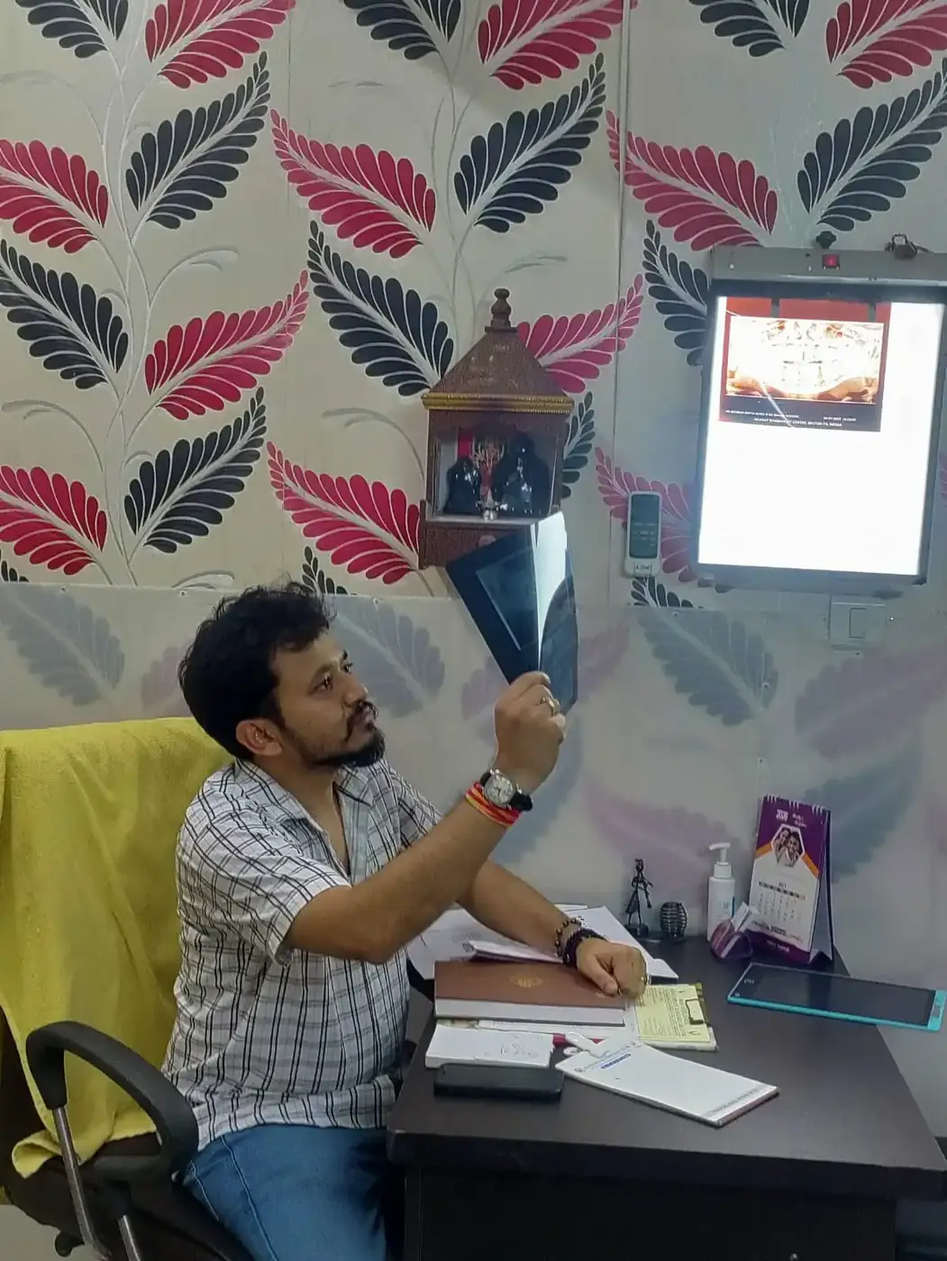 Dentist reviewing a digital dental X-ray with a patient